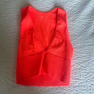 Out from under Urban Outfitter’s Coral Tank